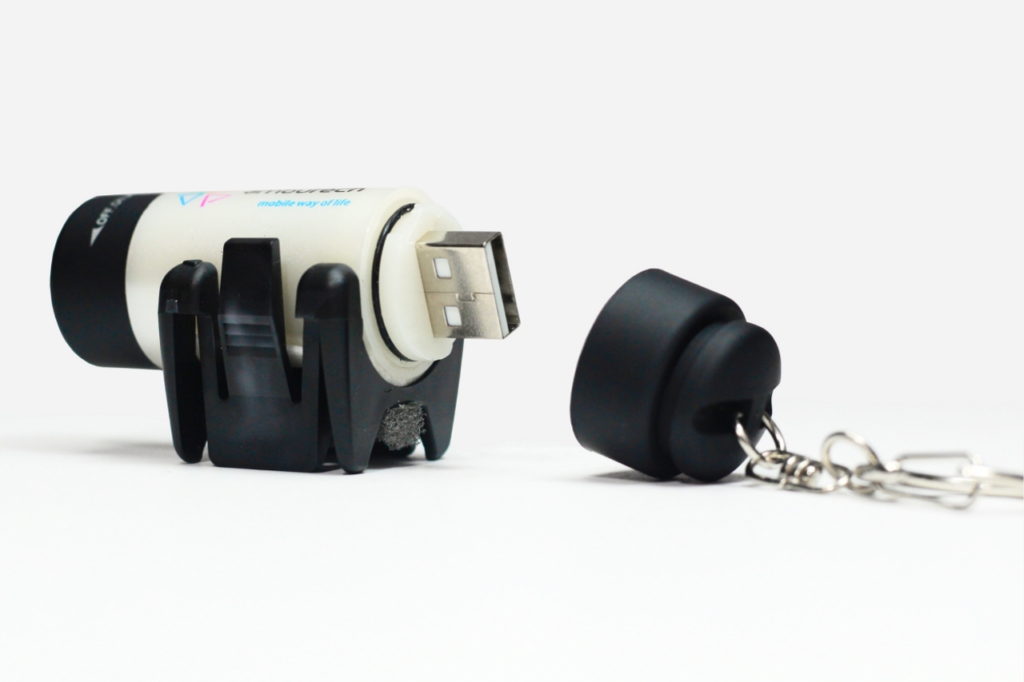 Small, White, cylinder-shaped Clip-on USB Light attachment for mobility cane