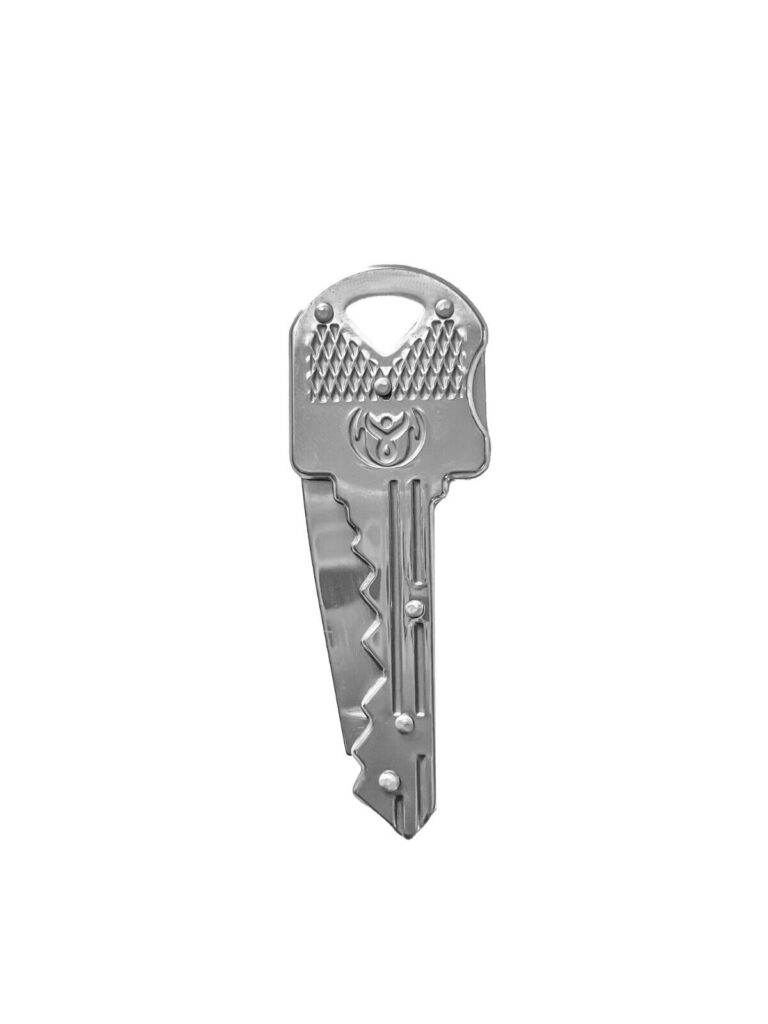 Silver charm that looks like a standard "Door Key" but has hidden knife blade