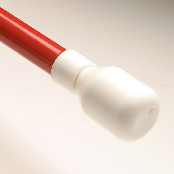 White Marshmallow tip attached to a red cane against a tan background.