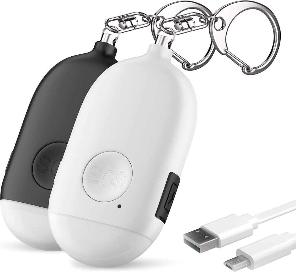 This product image displays two black and white oval shaped alarm charms with a large button that reads "SOS"