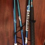 Image of graphite folding cane depicting one of our over 250 colors! This cane is the chameleon cane that changes color from green to to purple to blue. Accented with dragonflies throughout each section.