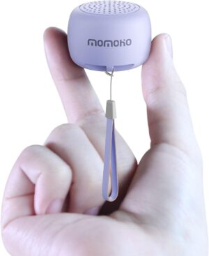 two fingers holding the purple tiny bluetooth speaker