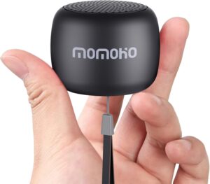 a hand holding the black, mini bluetooth speaker cane charm