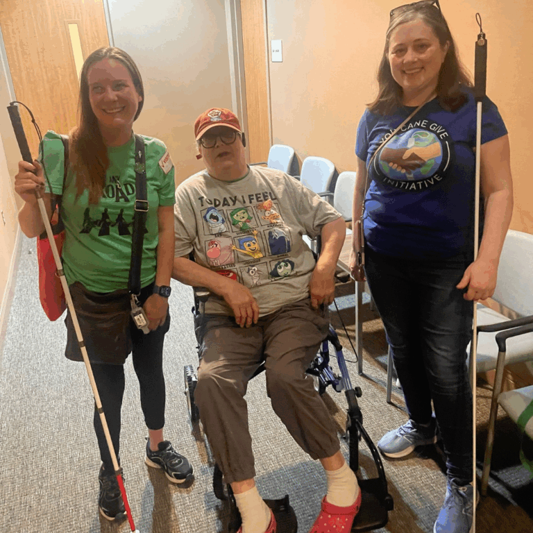 three people smiling at a YGC/vanderbilt eye institute event